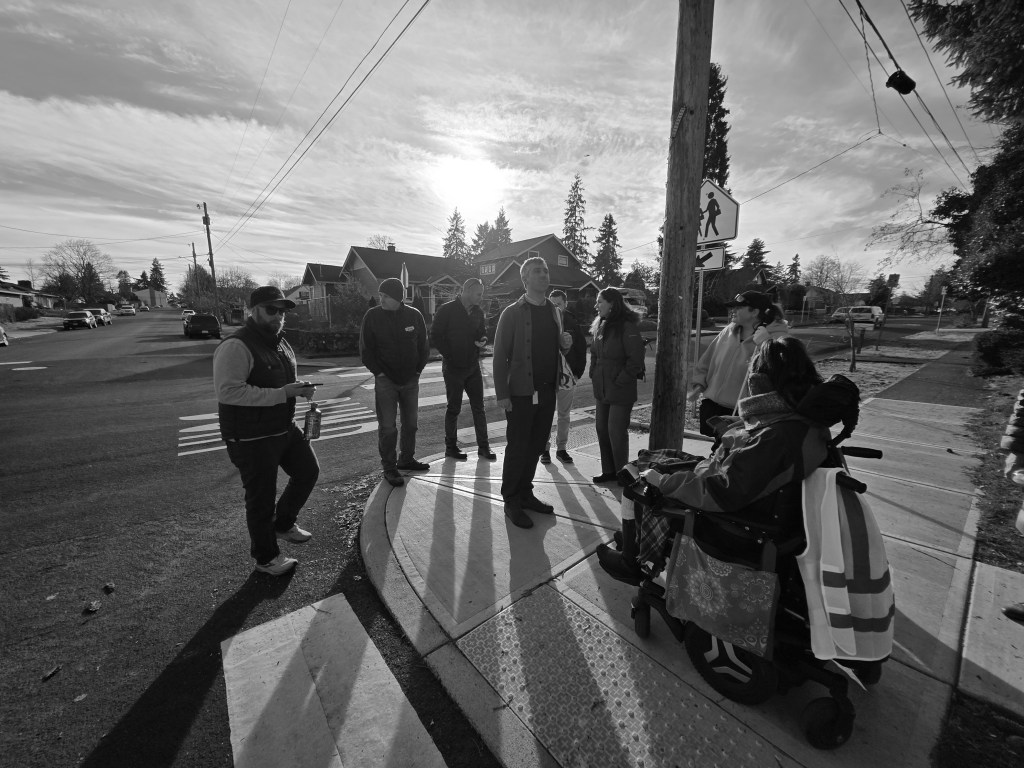 a group of people with disabilities on a corner